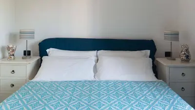Letto o letti in una camera di Porto Corallo Seafront