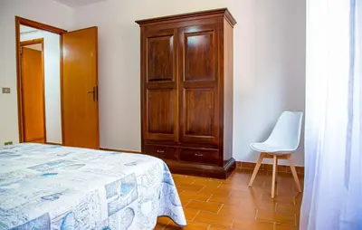 Letto o letti in una camera di Casa Baddò, fronte spiaggia Air Con IUN R1866