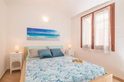 Letto o letti in una camera di Glori House 50m from Marina di Olbia - Happy Rentals