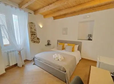 Letto o letti in una camera di Holmann Suite & Rooms