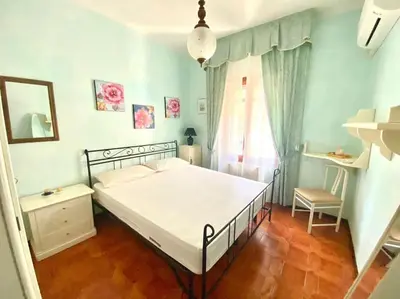 Letto o letti in una camera di Villa Fiorita