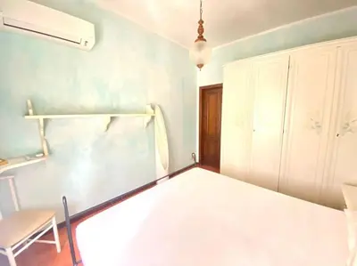 Letto o letti in una camera di Villa Fiorita