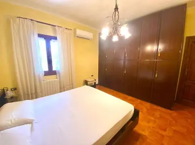 Letto o letti in una camera di Villa Fiorita