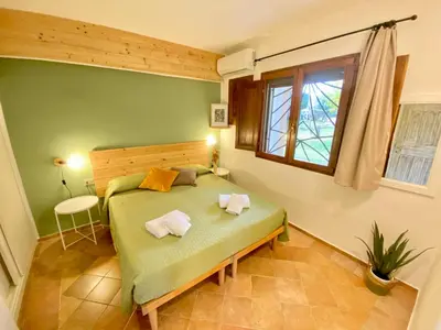 Letto o letti in una camera di Residence La Rosa