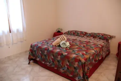 Letto o letti in una camera di La Giara d'Ambra Garden House