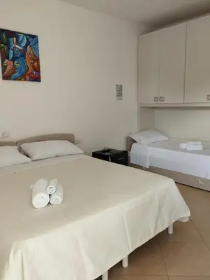 Letto o letti in una camera di Affitta Camere Zio Peppe