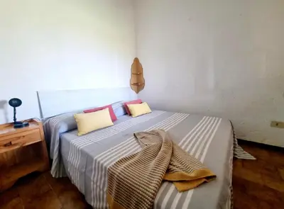 Letto o letti in una camera di SAN TEODORO CENTRO SPLENDIDO bilocale