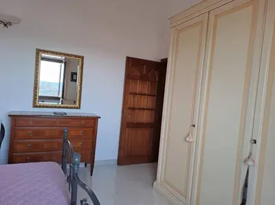 Letto o letti in una camera di S'Altura, dall'alto di Nuoro