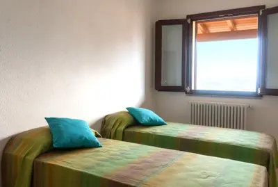 Letto o letti in una camera di La Terrazza In Centro Dorgali