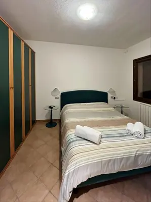 Letto o letti in una camera di Villa Aurelia