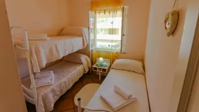 Letto o letti in una camera di Casa Vacanze Arianna