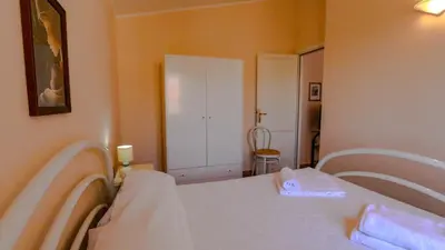 Letto o letti in una camera di Casa Vacanze Arianna