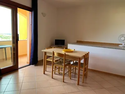 TV o dispositivi per l'intrattenimento presso Luna Case Vacanza Il Mirto