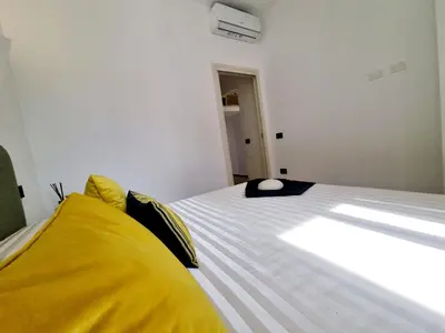 Letto o letti in una camera di STAZZO SAN TEODORO IL GINEPRO Piscina Condivisa