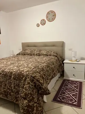 Letto o letti in una camera di Home and Life Olbia Holiday