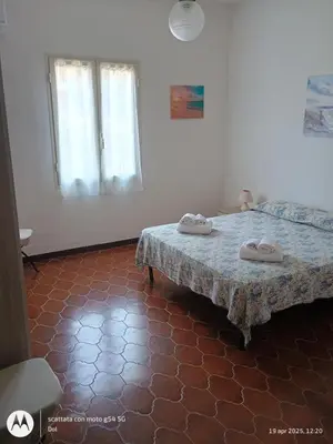 Letto o letti in una camera di La Terrazza Di Chiara