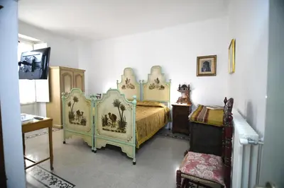Letto o letti in una camera di Domo Peonia Bianca