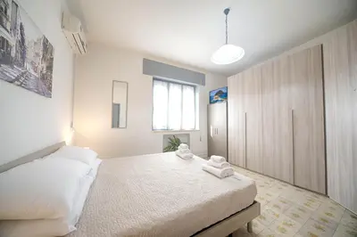 Letto o letti in una camera di helichrysum hospitality 85mq relax nel centro di olbia