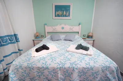 Letto o letti in una camera di Sardinian Cottage, 150m from the sea, private Garden