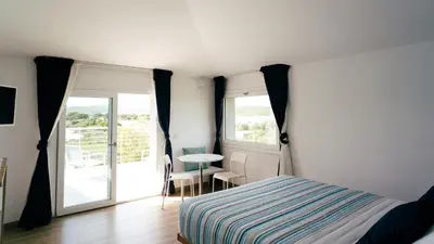 Letto o letti in una camera di LIDO DEL FARO