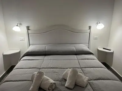 Letto o letti in una camera di S' Agrùstu