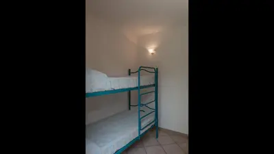 Letto o letti in una camera di Simple Gem of Le Dimore di Budoni 2 Bedroom Trilo6 Apartment sleeps 6 persons
