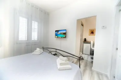 Letto o letti in una camera di Margherita Guest House