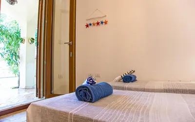 Letto o letti in una camera di Casa Silvia Marina - Cala Gonone
