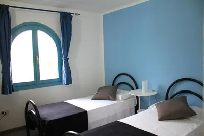 Letto o letti in una camera di Li Piri