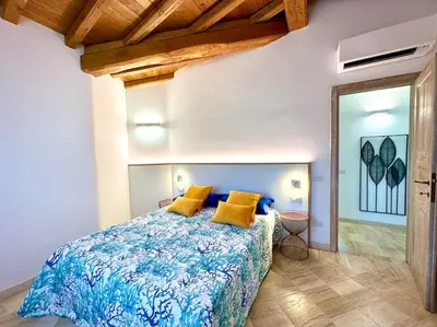 Letto o letti in una camera di Villa Azzurra