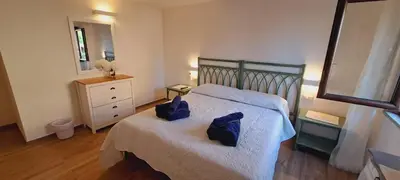 Letto o letti in una camera di San Teodoro Rooms