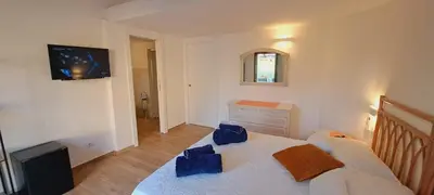 Letto o letti in una camera di San Teodoro Rooms