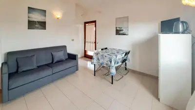 Area soggiorno di Appartamento Bilocale Valentina's House San Teodoro