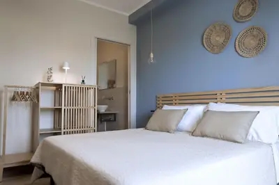 Letto o letti in una camera di Sunrise Sardinia Posada