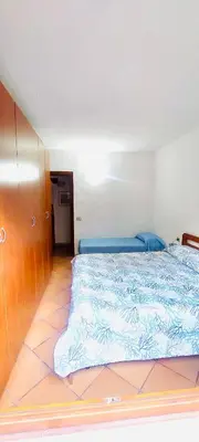 Letto o letti in una camera di Trilocale i Fenicotteri