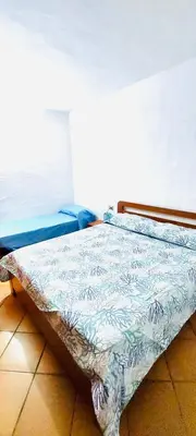 Letto o letti in una camera di Trilocale i Fenicotteri