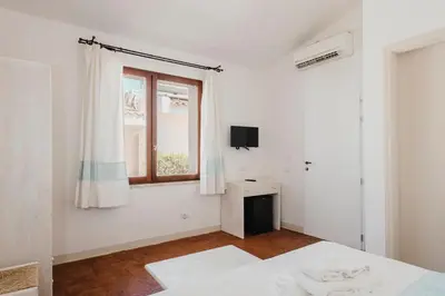 Letto o letti in una camera di Resort Fior di Sardegna