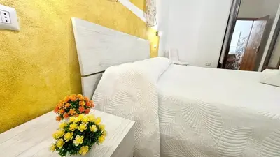 Letto o letti in una camera di CASA DEL CORSO