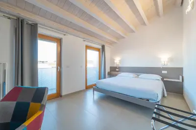 Letto o letti in una camera di Nuova -Luxury Rooms & Apartment-