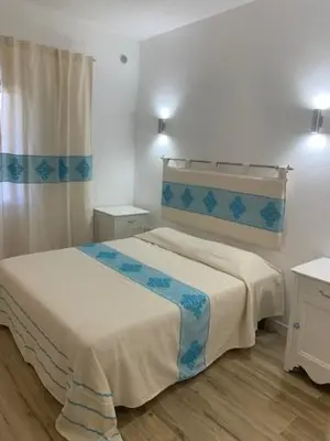 Letto o letti in una camera di B&B Olbia City Center