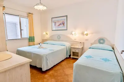 Letto o letti in una camera di ISA-Appartaments in Orosei with air conditioning