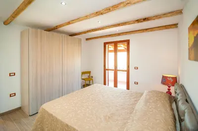 Letto o letti in una camera di Residence Tanaunella