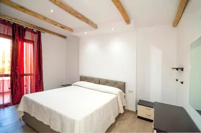 Letto o letti in una camera di Residence Tanaunella