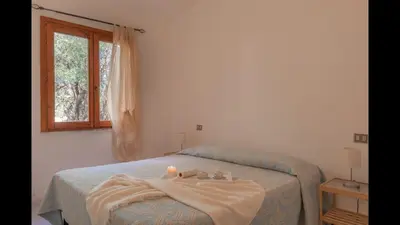 Letto o letti in una camera di Outstanding Residenze Gallura 2 Bedroom sleeps with Child