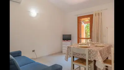 TV o dispositivi per l'intrattenimento presso Outstanding Residenze Gallura 2 Bedroom sleeps plus Child