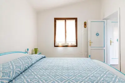 Letto o letti in una camera di Cala Paradiso Apartment 