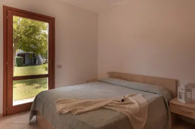 Letto o letti in una camera di Simple Gem of Le Dimore di Budoni nui1676