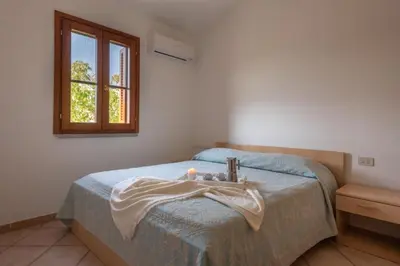Letto o letti in una camera di Simple Gem of Le Dimore di Budoni no1947