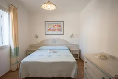 Letto o letti in una camera di Superb Le Residenze del Golfo di Orosei no2190