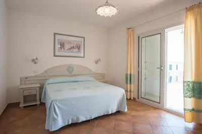 Letto o letti in una camera di Superb Le Residenze del Golfo di Orosei no2190
